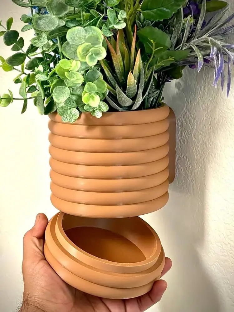 Wall mounted plant holder with hidden drip tray